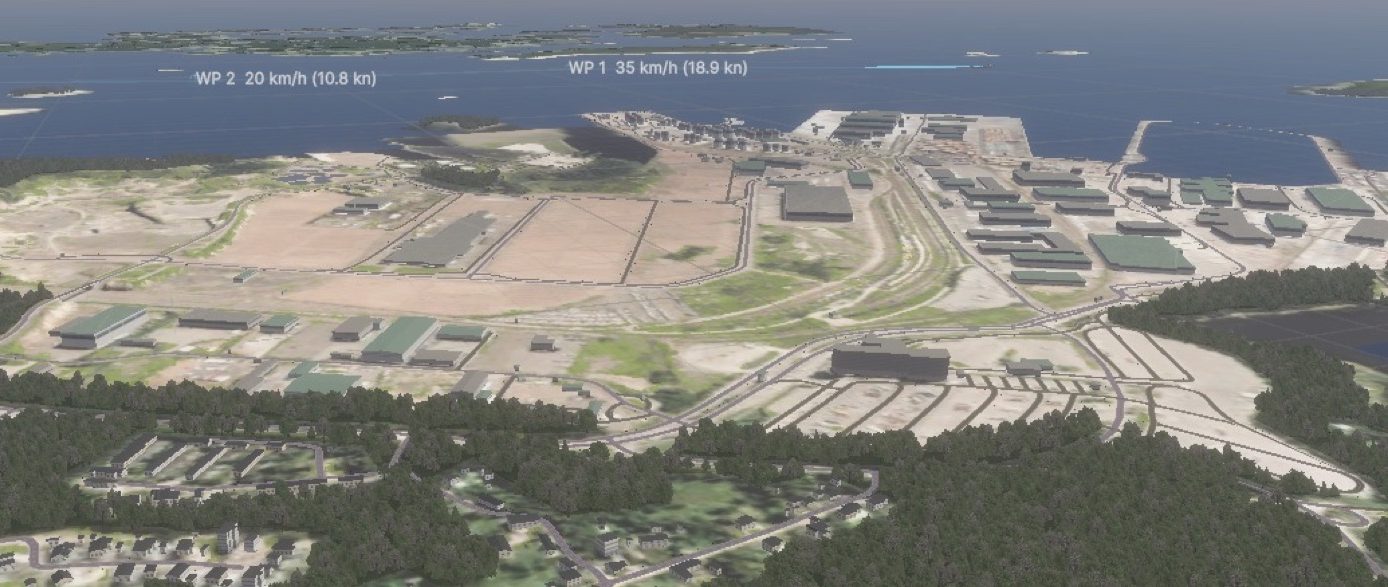 A real port from the air, photoreal terrain, with authored waypoints and their speeds marked over the water.